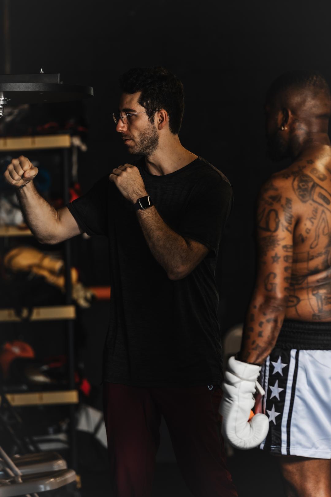 Coach demonstrating speed bag training